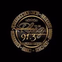 91.3 The Plug Radio logo