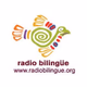 Logo de Radio Bilingüe - KVMG